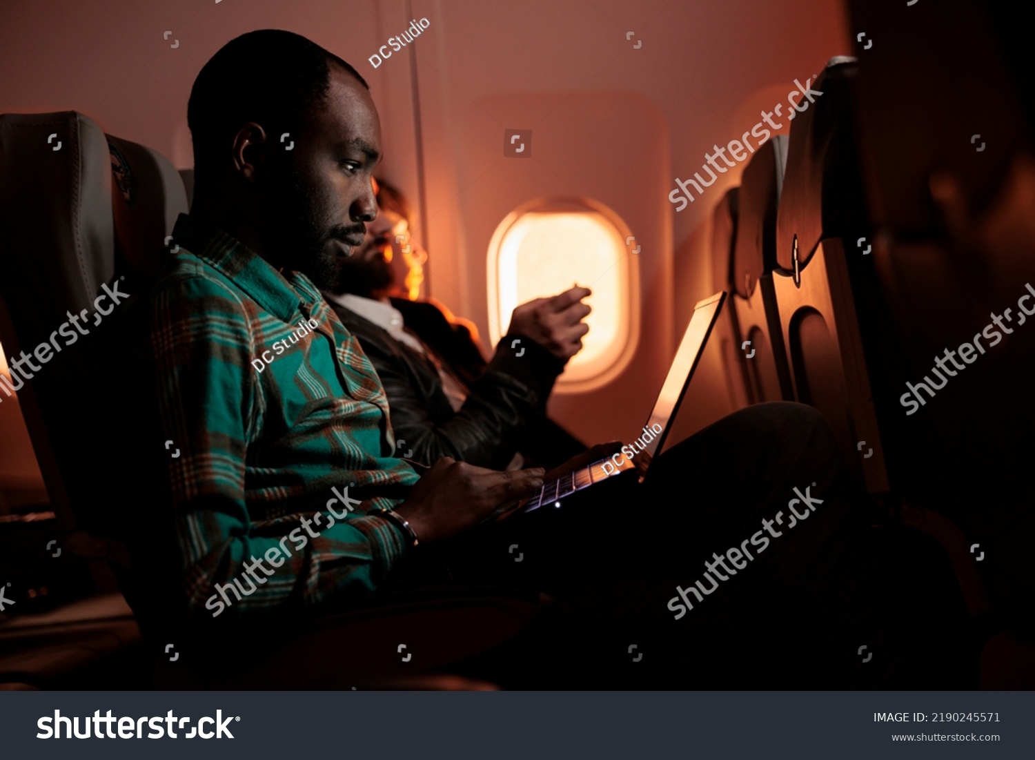 Airline passenger image covered by repeating diagonal Shutterstock watermarks