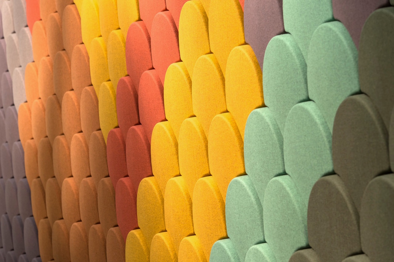 Colorful textured wall panels with repeating fabric patterns